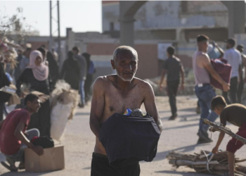 One killed, 48 wounded as forces fire on crowd overrunning Gaza aid site, officials say