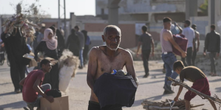 One killed, 48 wounded as forces fire on crowd overrunning Gaza aid site, officials say